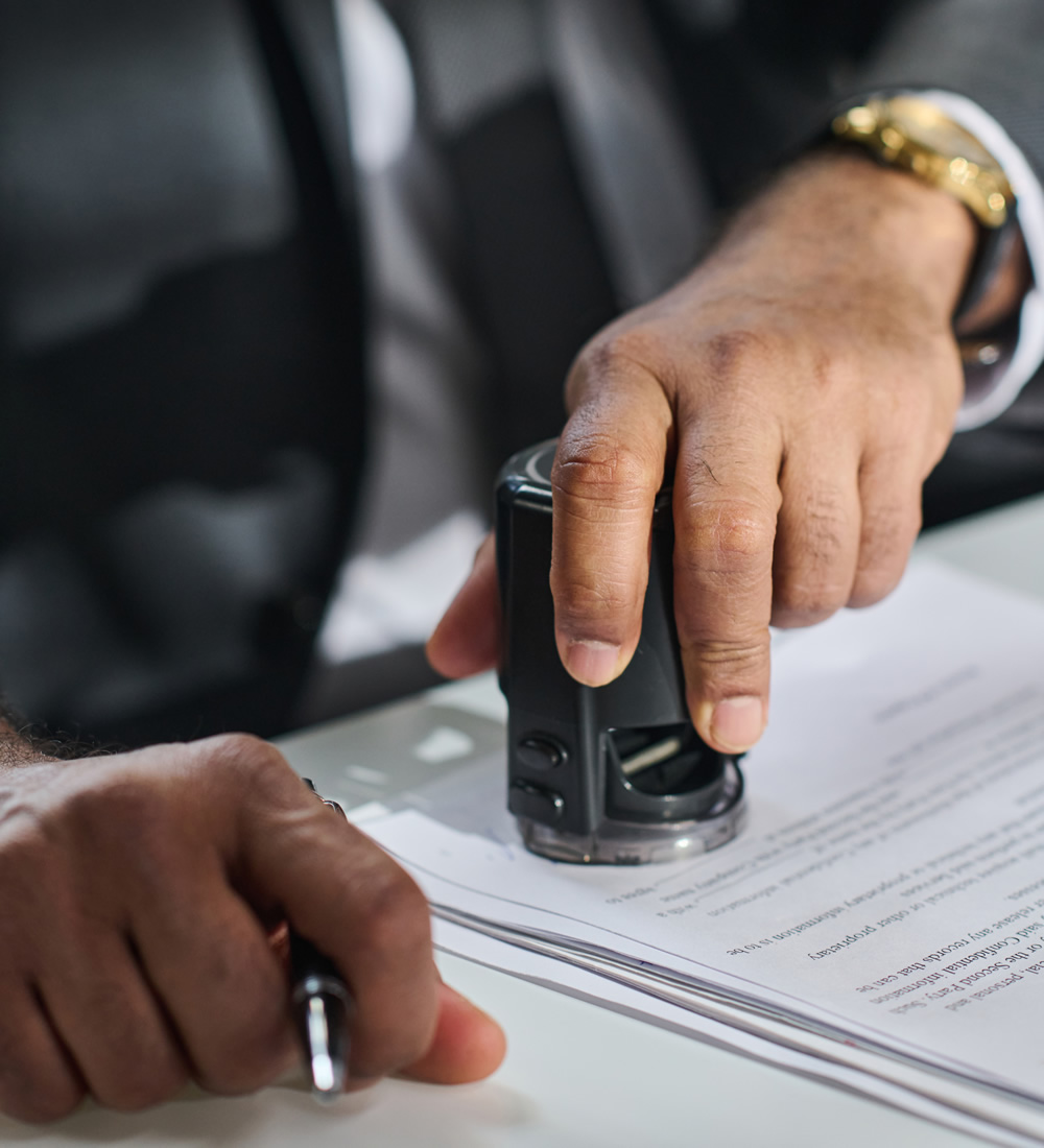 solicitor putting stamp contract